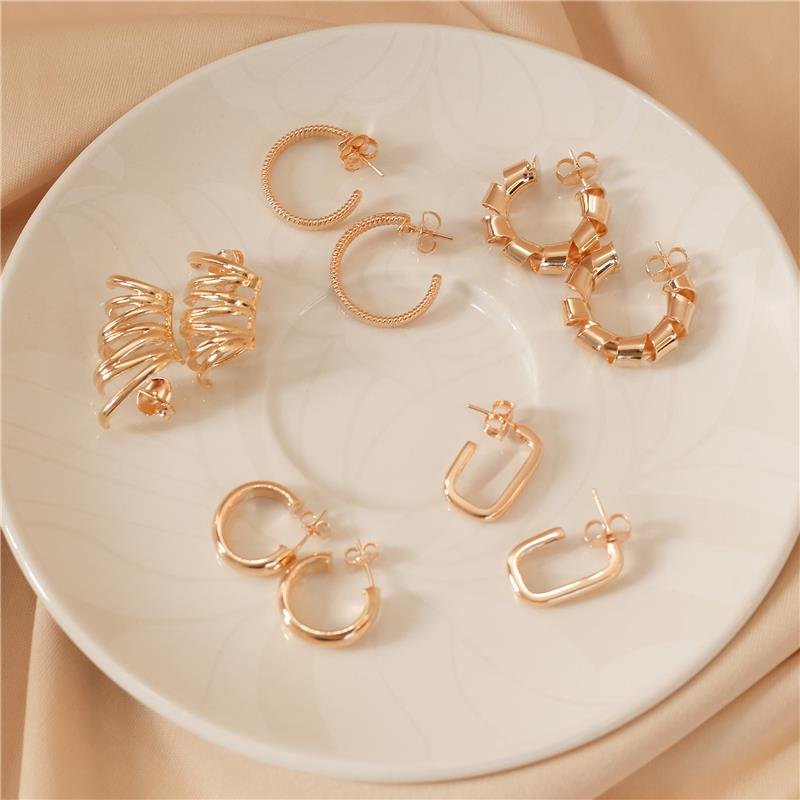 BRINCO ARGOLA COM DESIGN TORCIDO GRANDE EUGÊNIA BANHADO A OURO 18K