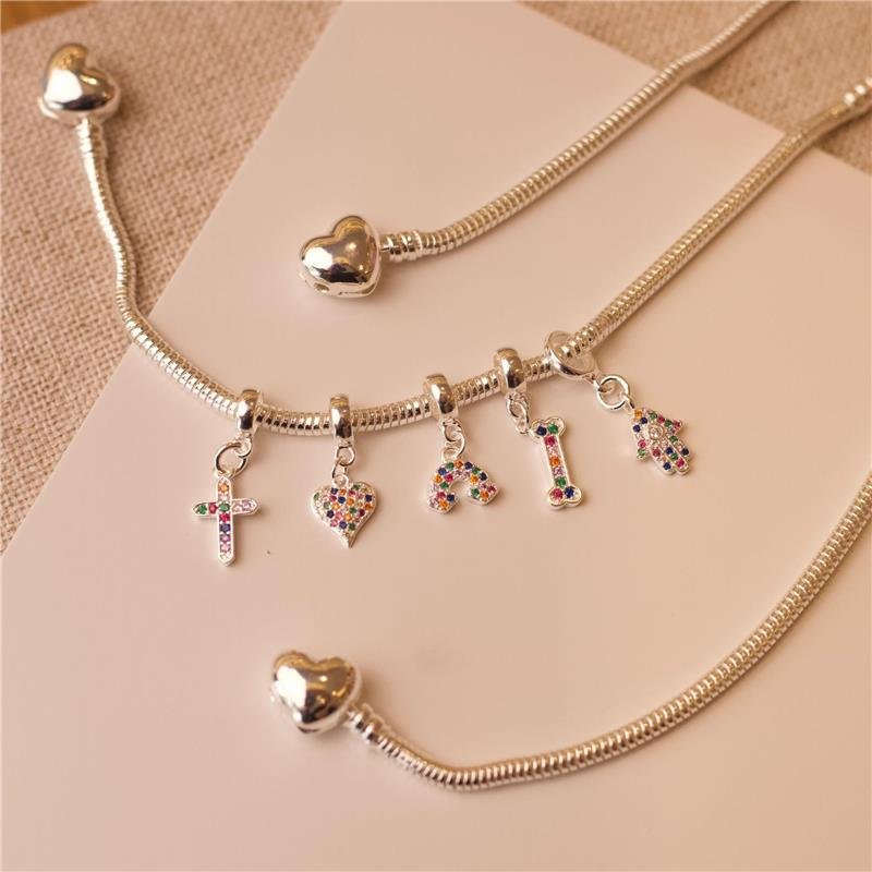 BERLOQUE CRUZ CRAVEJADO ZIRCÔNIA COLORIDA BANHADO A PRATA