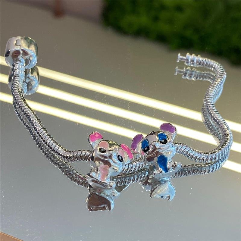 BERLOQUE SEPARADOR STITCH COM RESINA BANHADO A PRATA